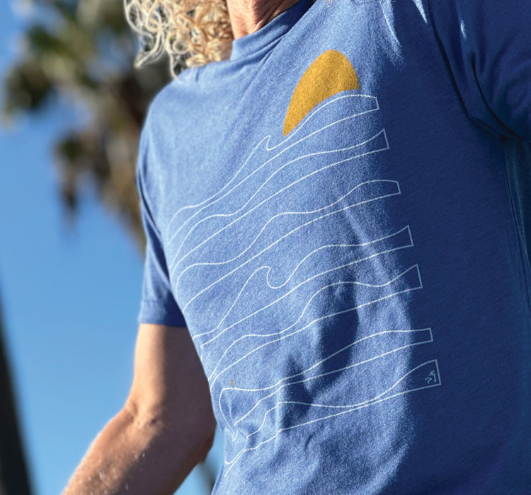 Close-up of blue t-shirt with minimalist wave design
