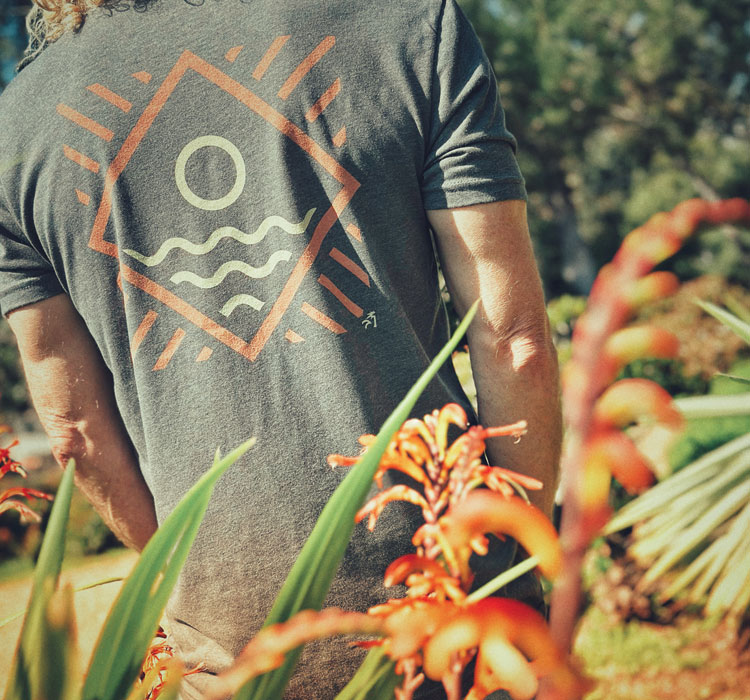 Back view of gray t-shirt with geometric sun/wave design