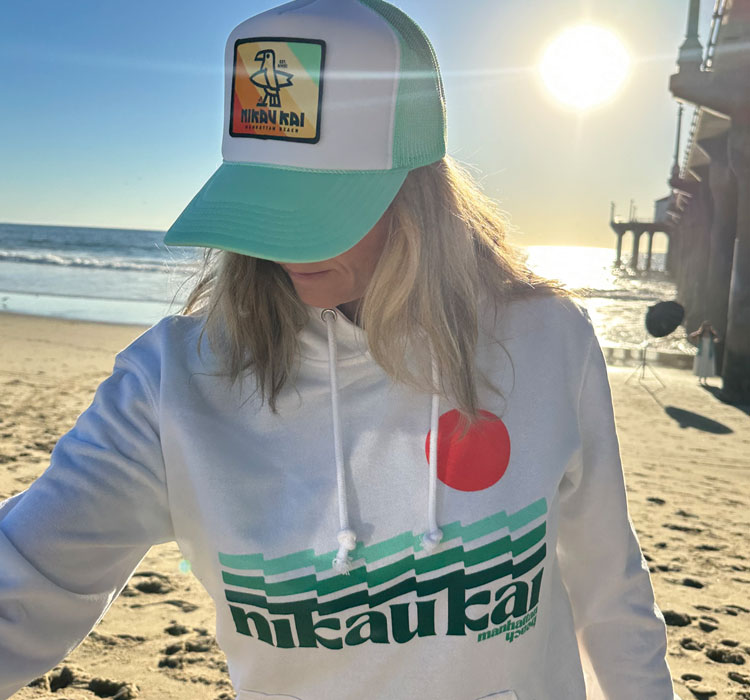 White hoodie with teal stripes and red sun logo