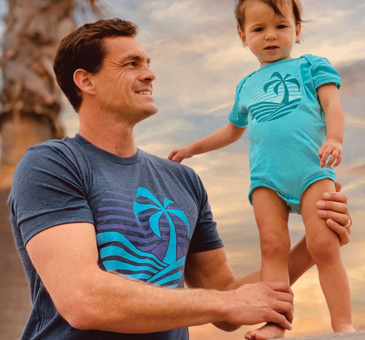 Father and child wearing matching Nikau Kai apparel